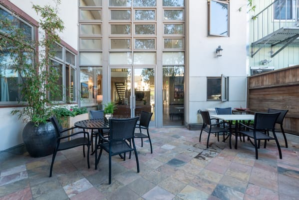 Outdoor patio area with tables and chairs