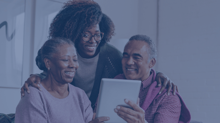 Residents and staff engaging with a tablet