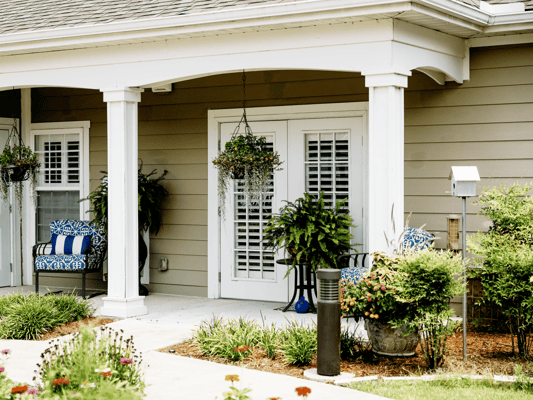 Welcoming entrance with seating and greenery
