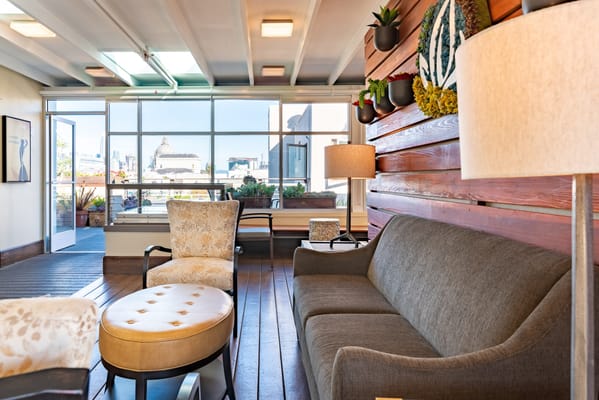 Bright common area with seating and outdoor view