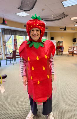 Resident dressed as a strawberry in a common area