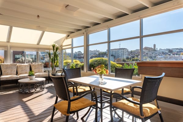 Bright common area with seating and a view