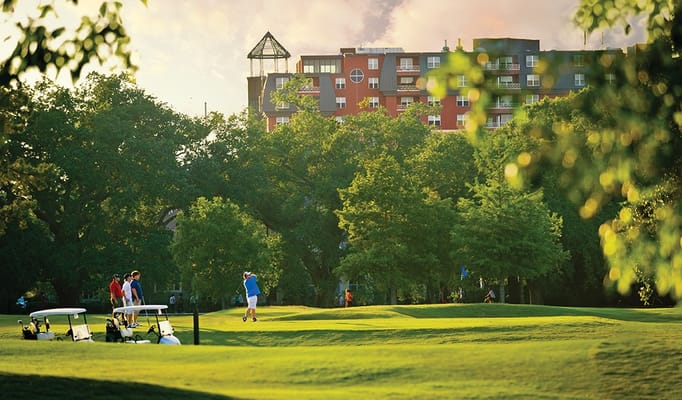 Residents enjoying outdoor golf activities at the facility