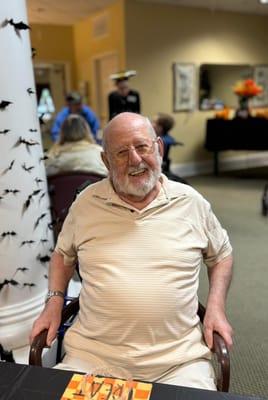 Resident smiling in an activity area