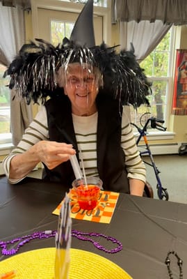 Resident participating in a Halloween-themed activity