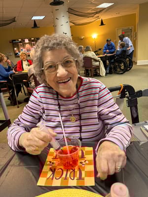 Resident enjoying a festive activity with food