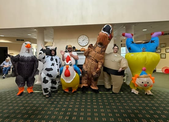 Residents and staff in inflatable costumes during an activity