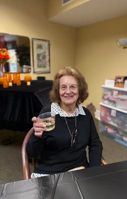 Resident enjoying a drink in a social setting