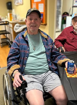 Resident enjoying a drink in a common area