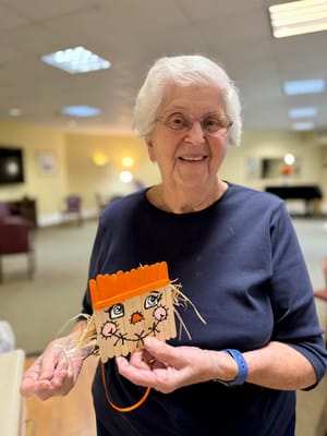Resident participating in an arts and crafts activity