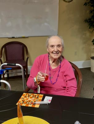 Resident enjoying a drink at a social event