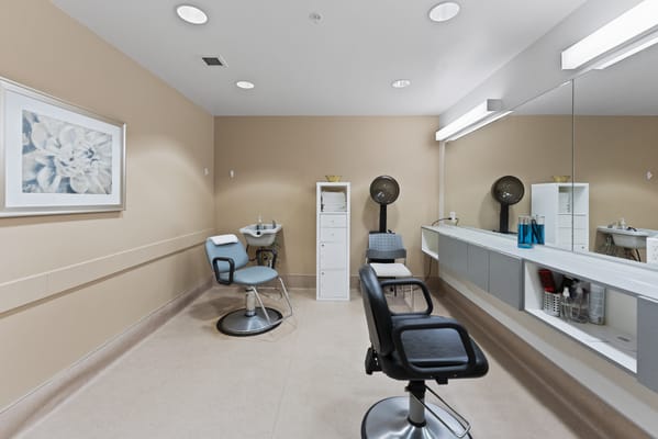 Interior view of a salon with styling chairs