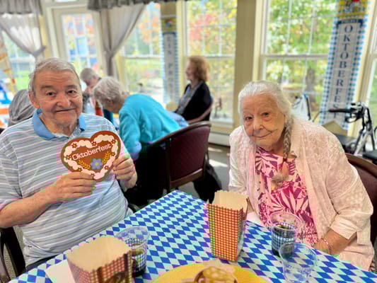 Two residents enjoying Oktoberfest activities