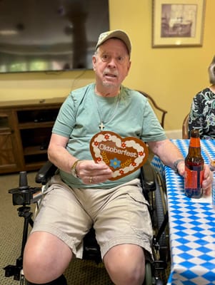 Resident celebrating Oktoberfest in a common area