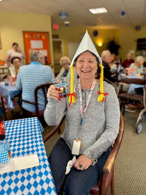 Resident enjoying a festive activity in a common area