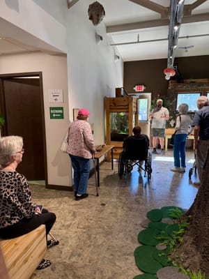 Residents engaging in an activity in the facility's common area