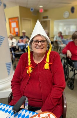 Resident celebrating with festive attire in the common area