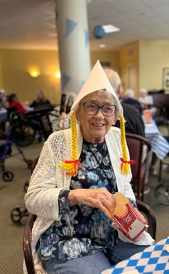 Resident enjoying a festive activity with food