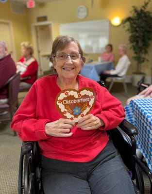 Resident celebrating Oktoberfest in a common area