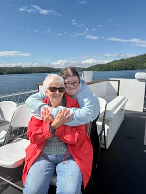 Two residents enjoying time together on a boat trip