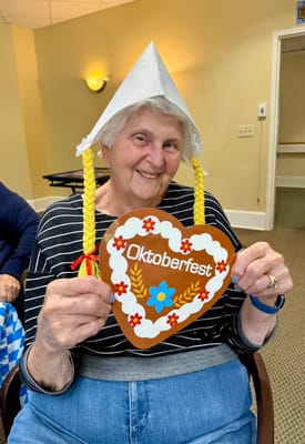Resident celebrating Oktoberfest with a festive hat