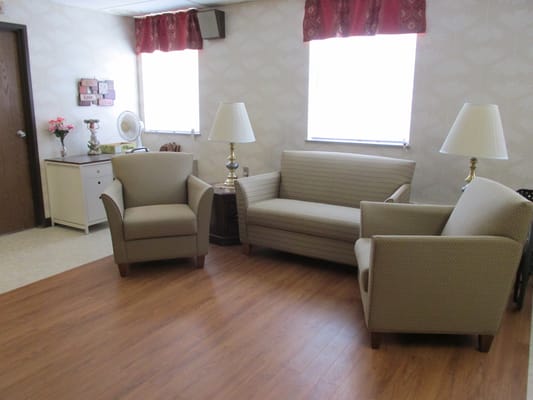 Cozy lounge area with seating in a senior living facility