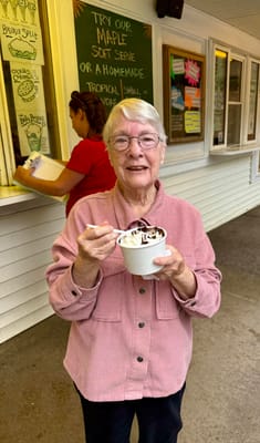 Senior resident enjoying ice cream outdoors