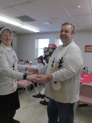 Residents participating in a festive activity indoors