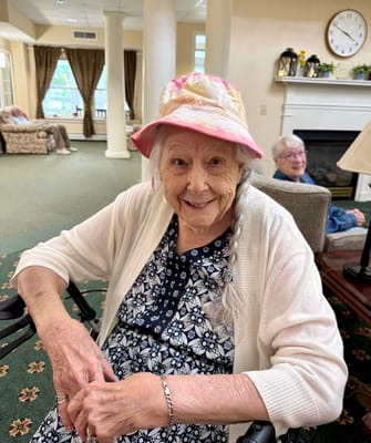 Senior resident smiling in a common area