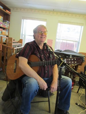 Resident enjoying a live music performance in a common area