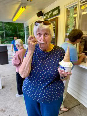 Resident enjoying ice cream at an outdoor shop