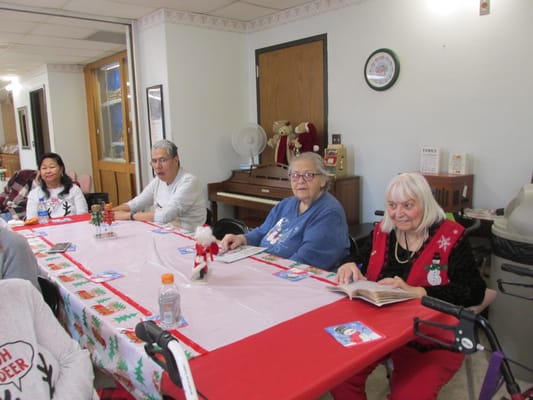 Residents enjoying a holiday-themed gathering in a common area
