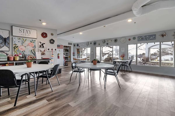 Bright activity room with tables and decorations