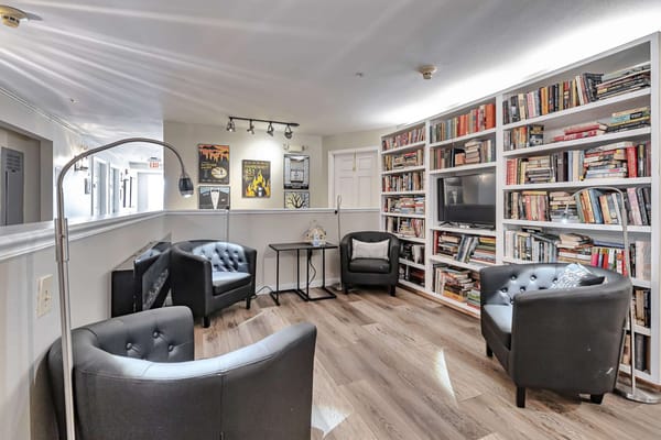 Common area with bookshelves and seating