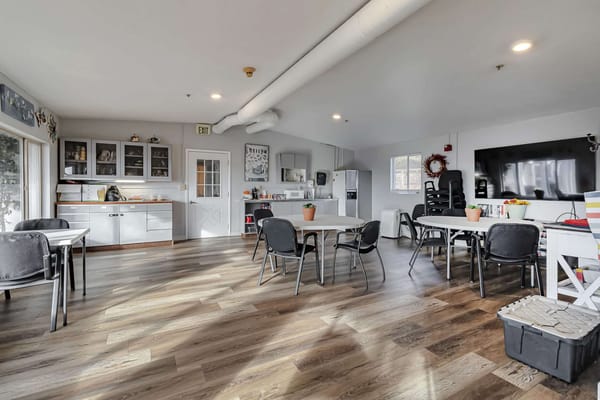 Bright interior of a common area with tables and chairs