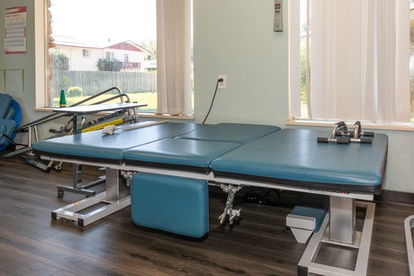 Rehabilitation therapy equipment in a bright treatment room