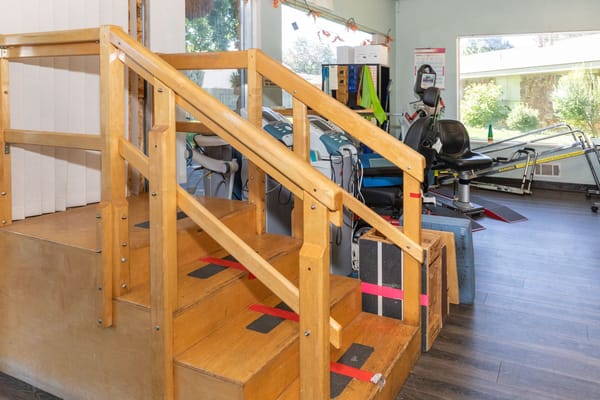 Interior view of a rehabilitation area with stair steps