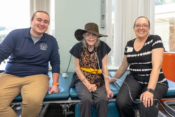 Staff and resident enjoying time together in a common area