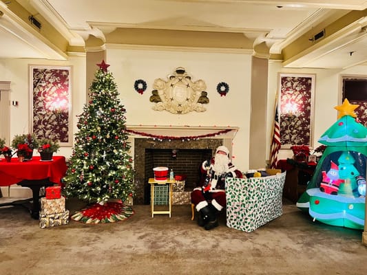 Residents celebrating Christmas in a decorated common area
