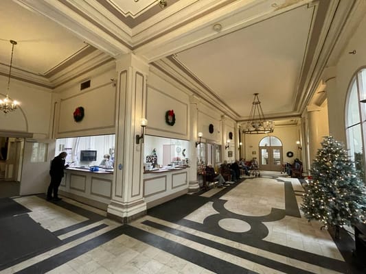 Interior lobby area with holiday decorations and residents