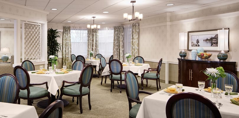 Elegant dining room setup with tables and chairs