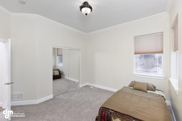 Interior view of a private resident room with a bed