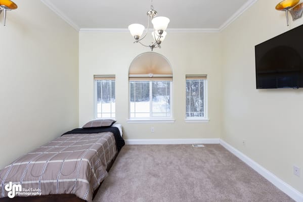 Bright, furnished resident room with a window