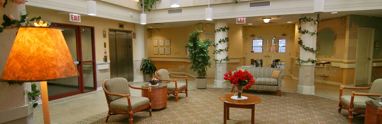 Bright lobby area with seating and plants
