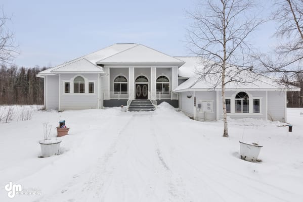 Exterior view of a senior living facility in winter
