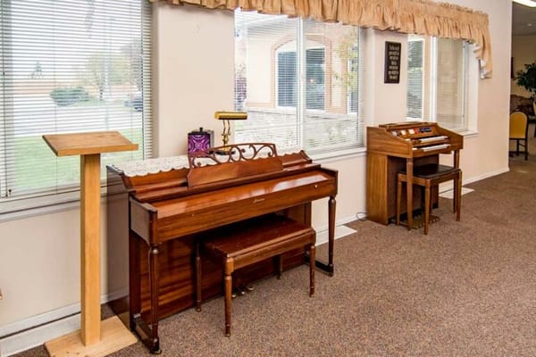 Interior view of a common area with pianos