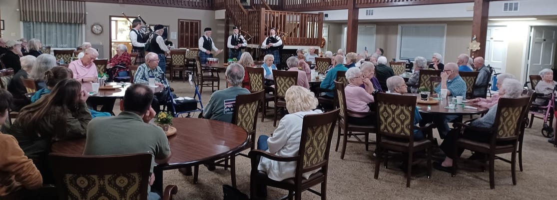 Residents enjoying a live performance in the common area