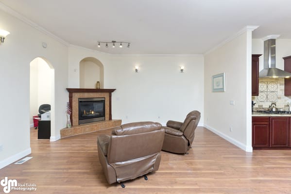 Cozy common area with chairs and a fireplace