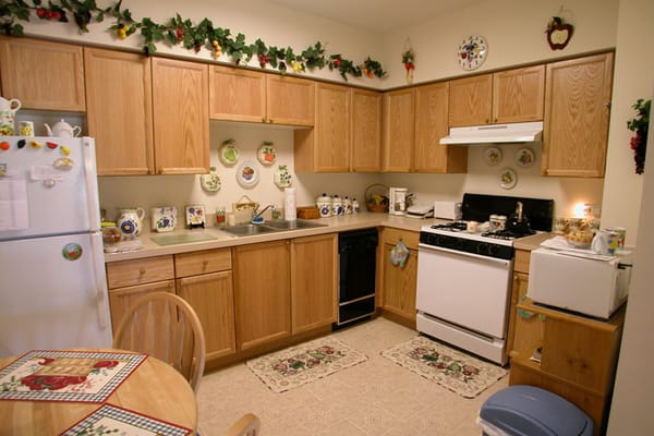 Cozy kitchen area with wooden cabinets and decor