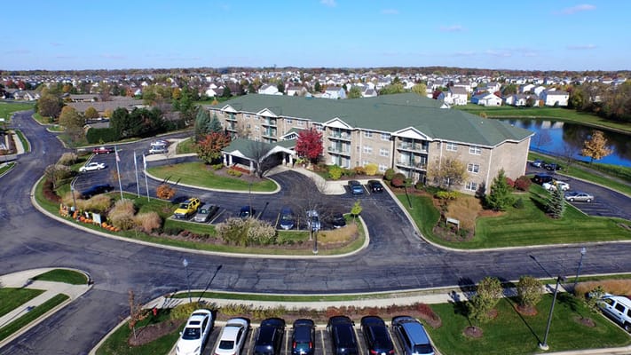 Aerial view of a senior living facility with landscaping